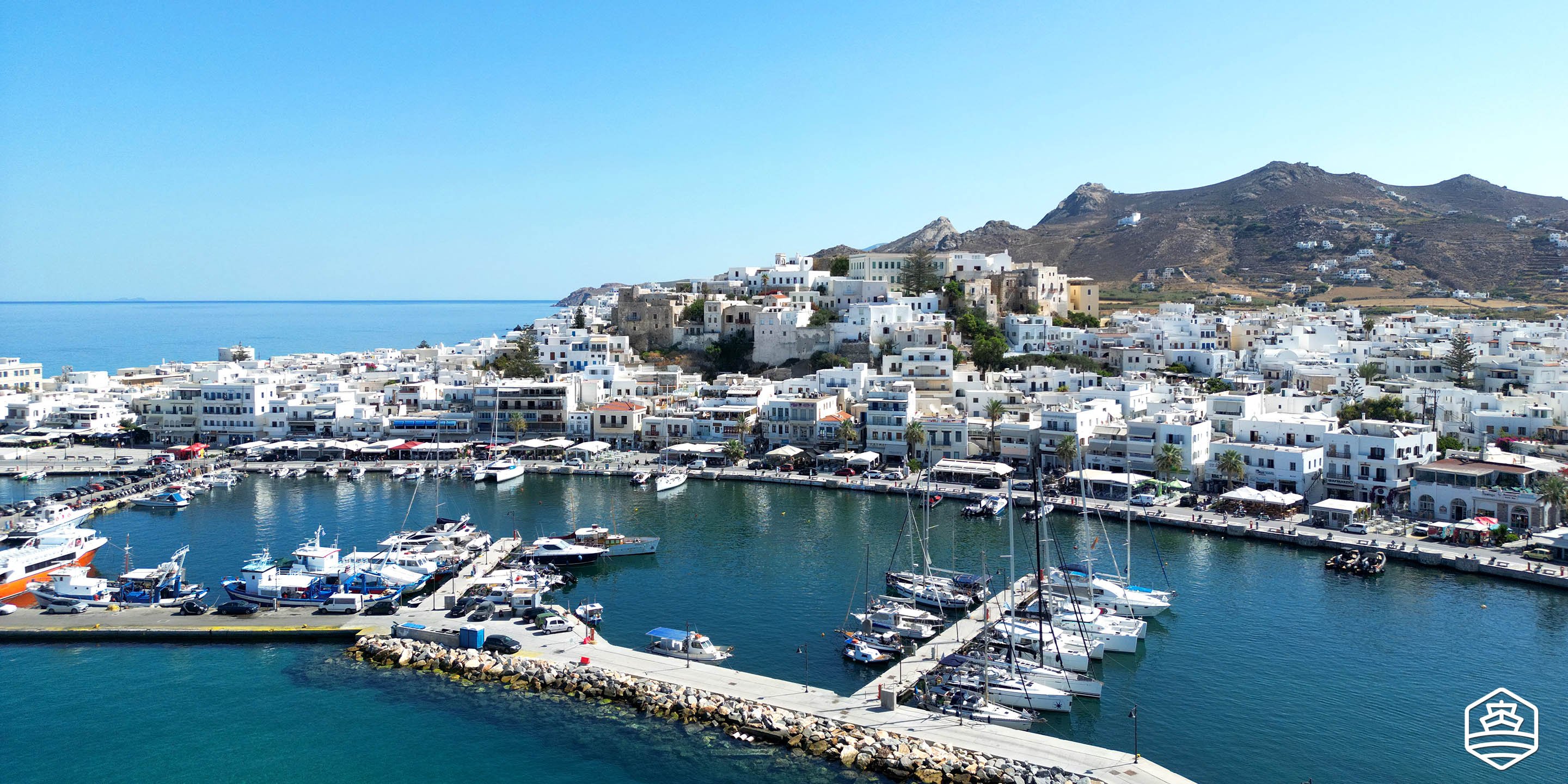 Aerial drone view of the town and port of Naxos island