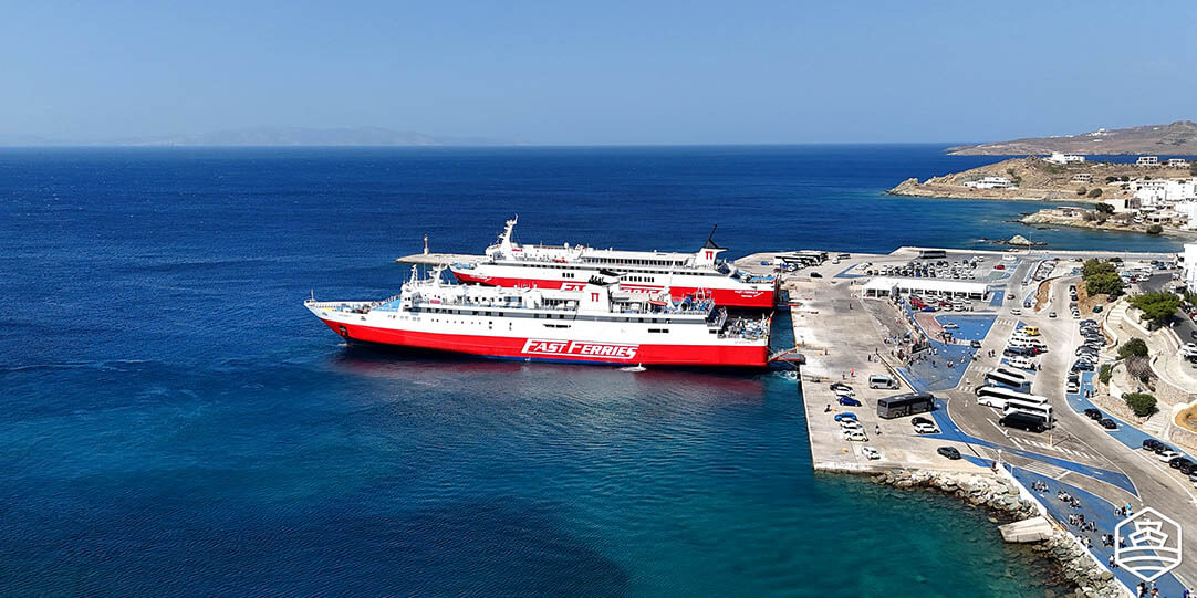 Aerial view of Tinos Port with two ferries of the company Fast Ferries