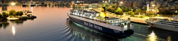 The conventional ferry Blue Galaxy arriving in the port Piraeus, by night